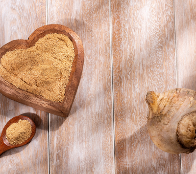 Organic maca root powder in a wooden bowl — Beauty Gummy ingredient